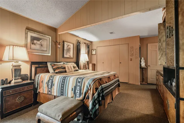 a bathroom with a tub a sink and a large mirror
