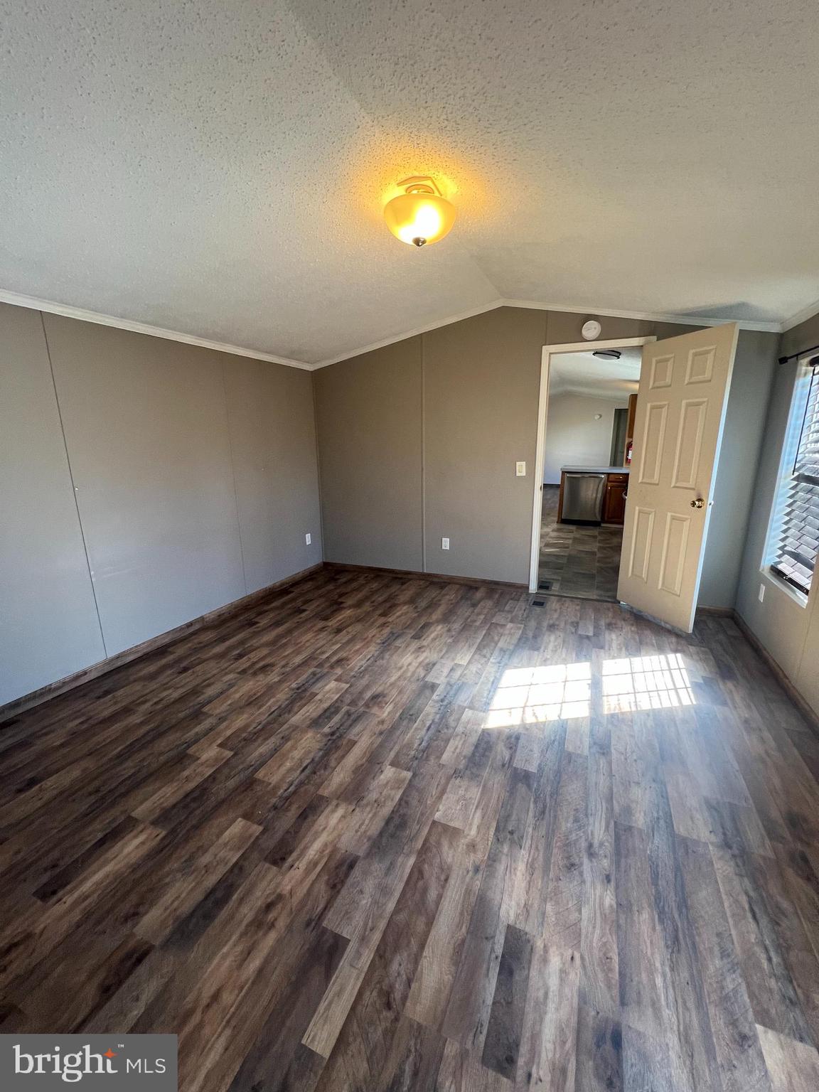 768 East Garden Road, Unit 14 Vineland, NJ 08360 - Photo 12 of 33 an empty room with wooden floor and windows
