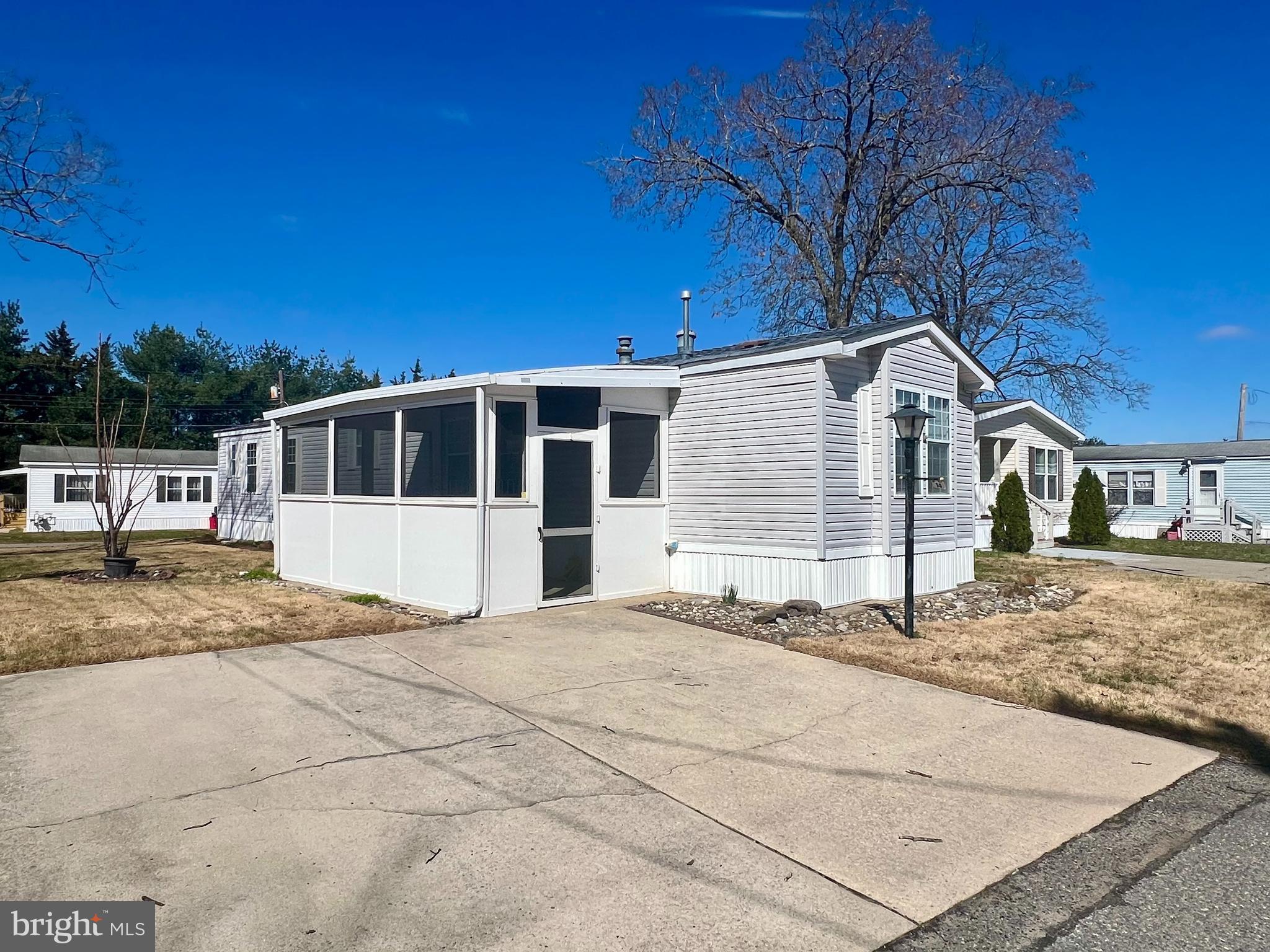 768 East Garden Road, Unit 14 Vineland, NJ 08360 - Photo 2 of 33 a front view of a house with a yard