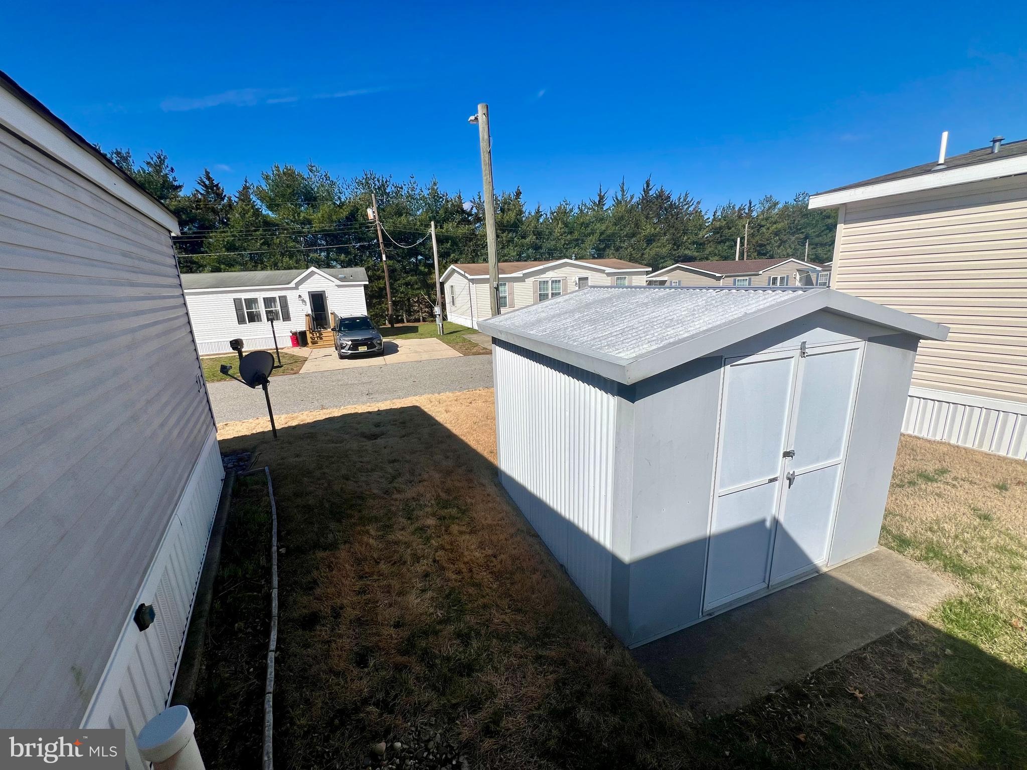 768 East Garden Road, Unit 14 Vineland, NJ 08360 - Photo 29 of 33 a view of a patio with couches and table and chairs with wooden fence