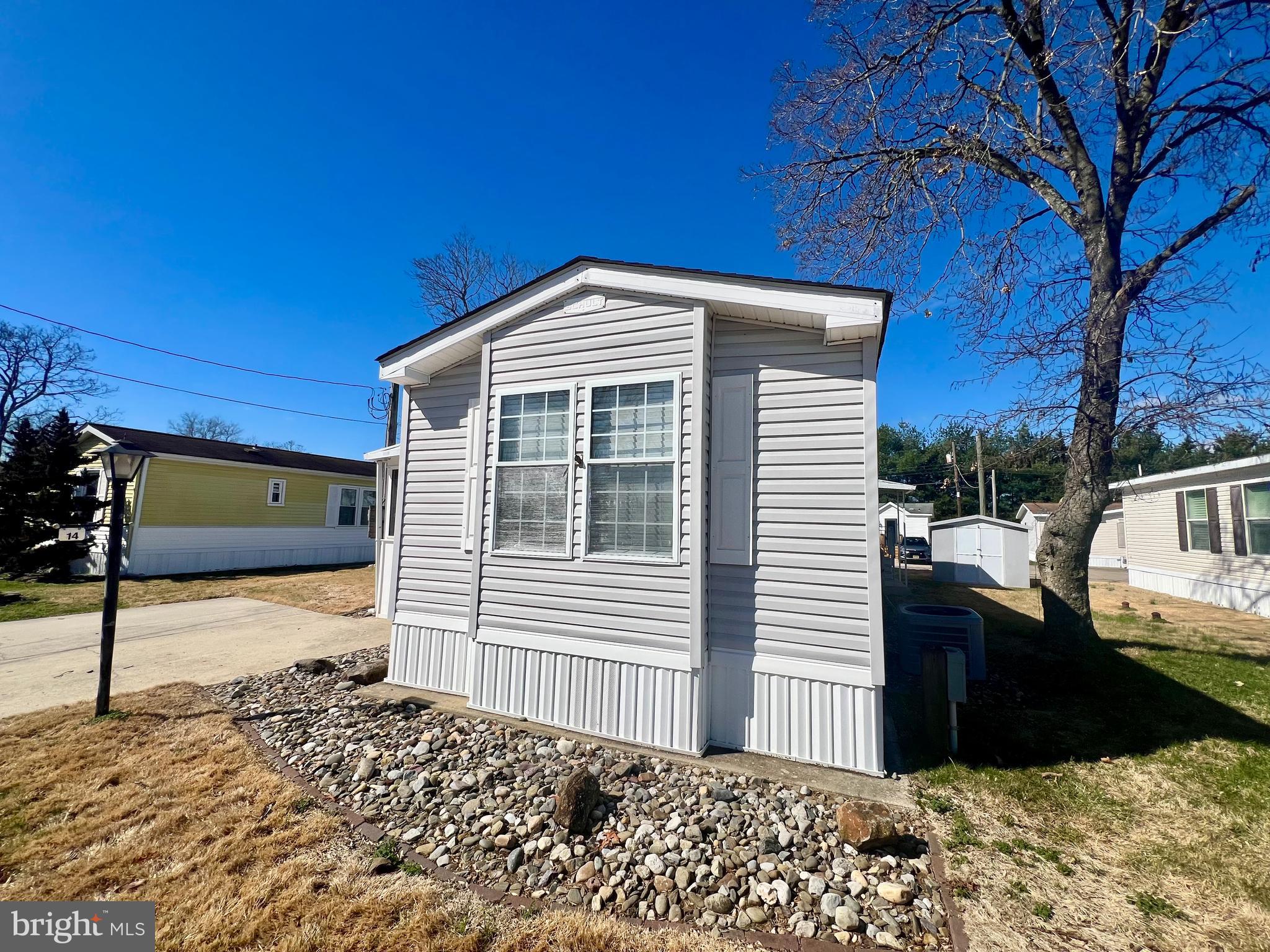 768 East Garden Road, Unit 14 Vineland, NJ 08360 - Photo 32 of 33 a front view of a house with a yard