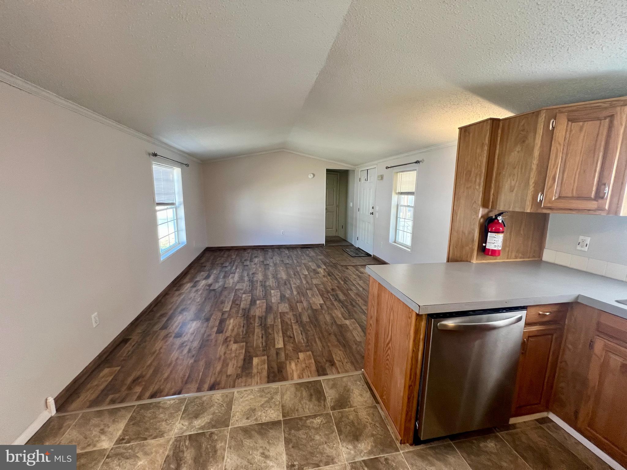 768 East Garden Road, Unit 14 Vineland, NJ 08360 - Photo 7 of 33 a kitchen with granite countertop a sink and a stove top oven