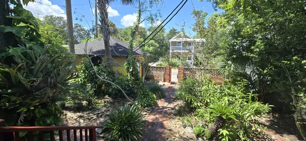 a view of a house with a tree