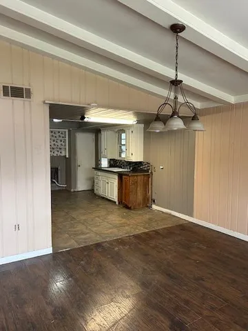 a view of a kitchen with a sink and stainless steel appliances