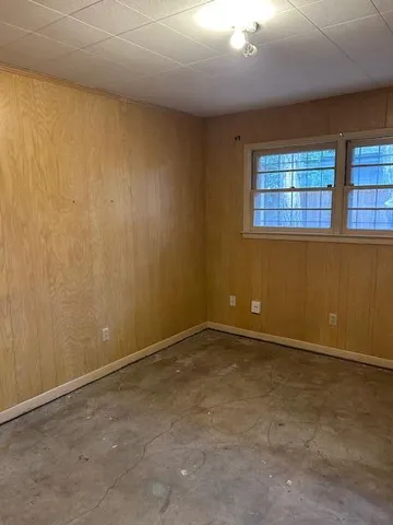 a view of a house with a large tree