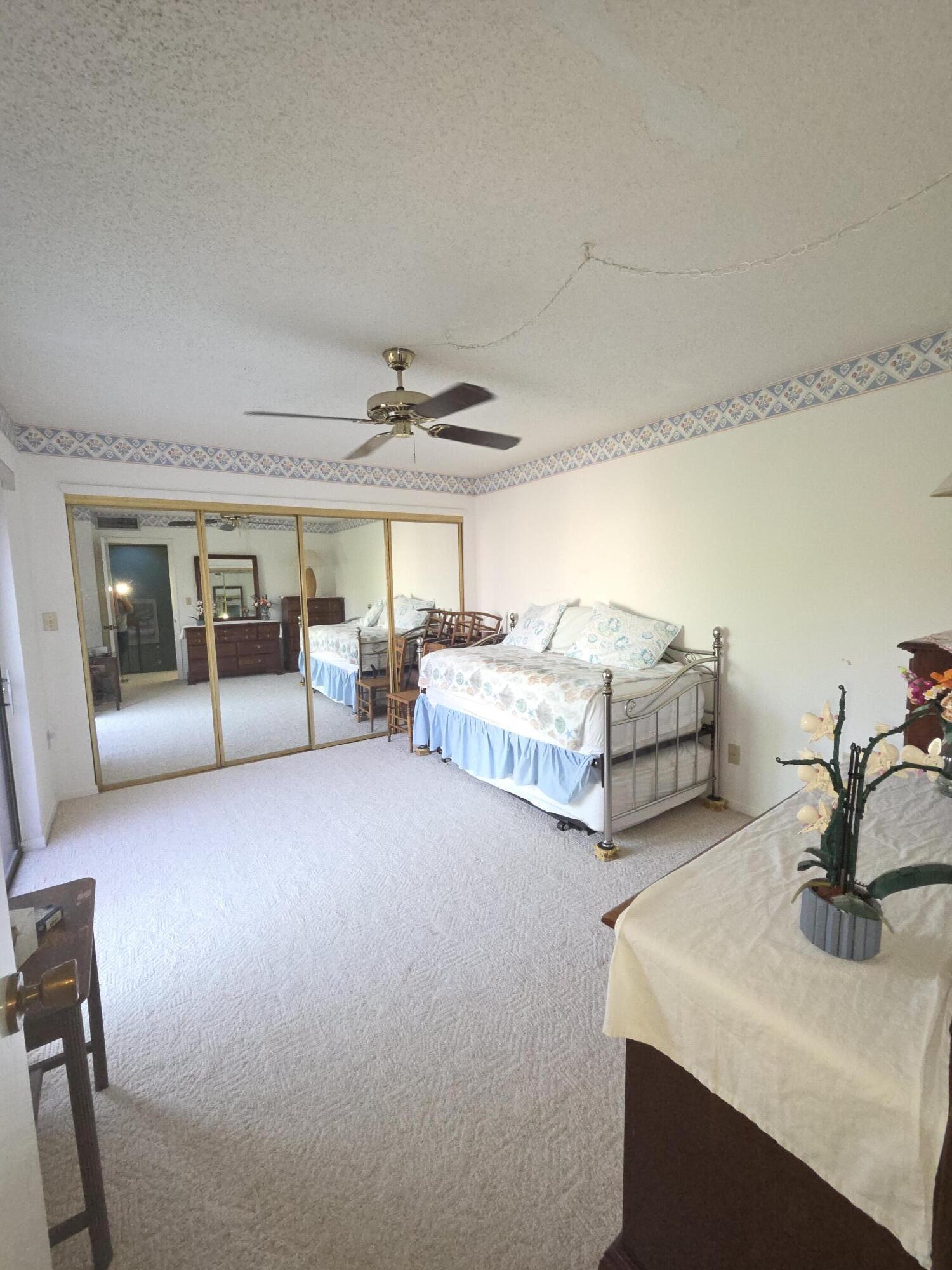 1170 6th Avenue, Unit 3A Vero Beach, FL 32960 - Photo 24 of 31 a spacious bedroom with a bed and window