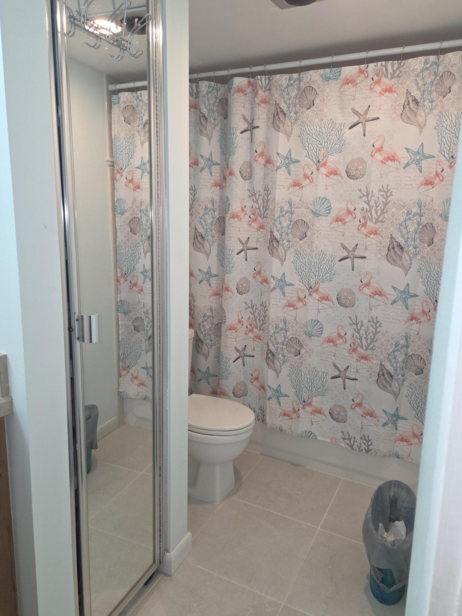 1170 6th Avenue, Unit 3A Vero Beach, FL 32960 - Photo 28 of 31 a bathroom with a toilet and a shower