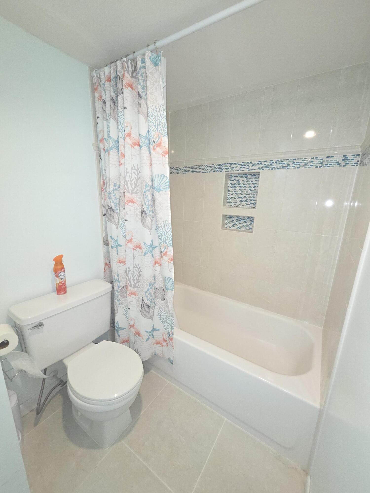 1170 6th Avenue, Unit 3A Vero Beach, FL 32960 - Photo 29 of 31 a bathroom with a toilet and a shower