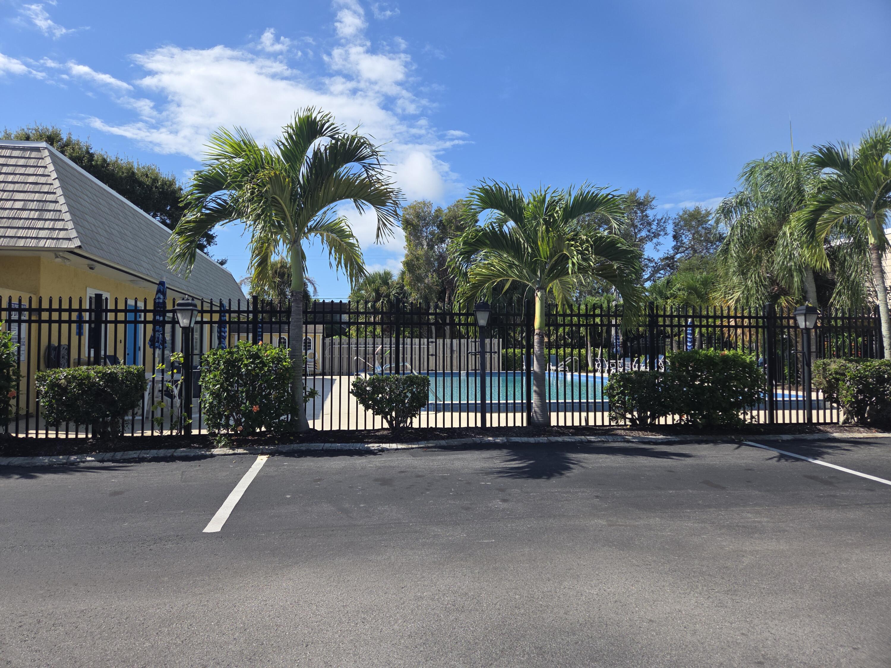 1170 6th Avenue, Unit 3A Vero Beach, FL 32960 - Photo 31 of 31 a view of a street with a cars parked in front of it