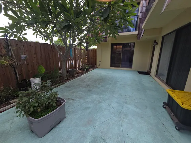a view of a wooden door and bench in a room