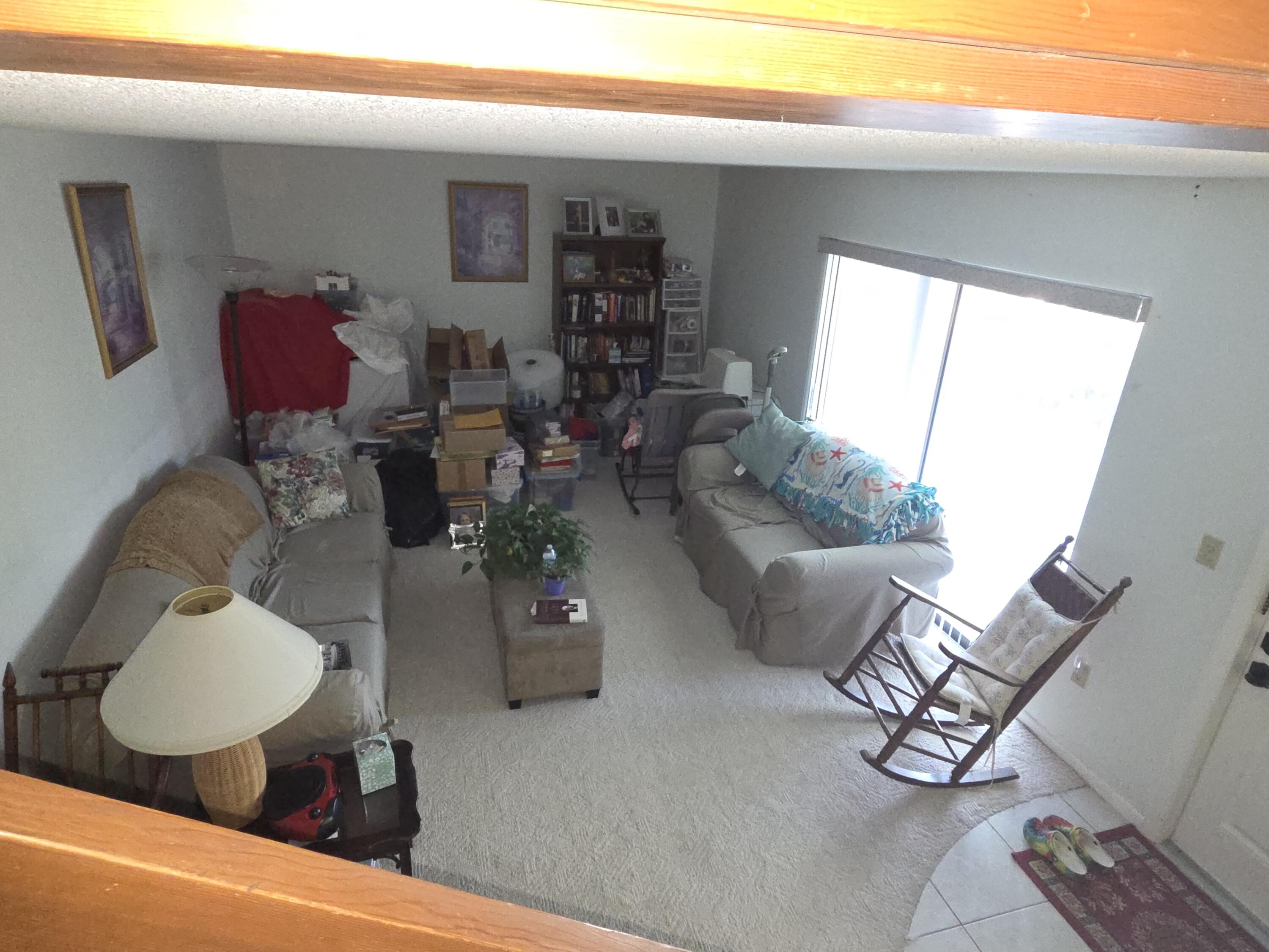 1170 6th Avenue, Unit 3A Vero Beach, FL 32960 - Photo 7 of 31 a living room with furniture and wooden floor