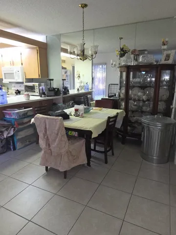 a kitchen with a table and chairs
