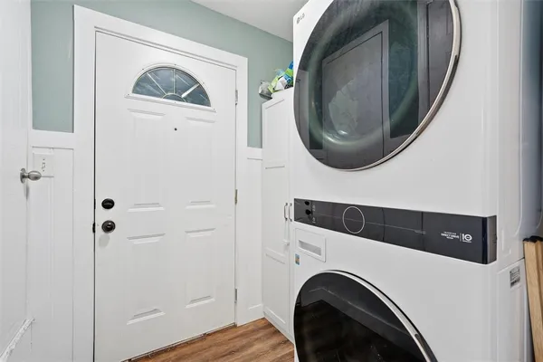 a view of a hallway with washer and dryer