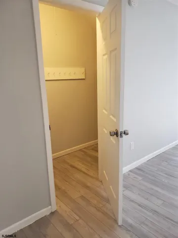 a view of a small space with wooden floor