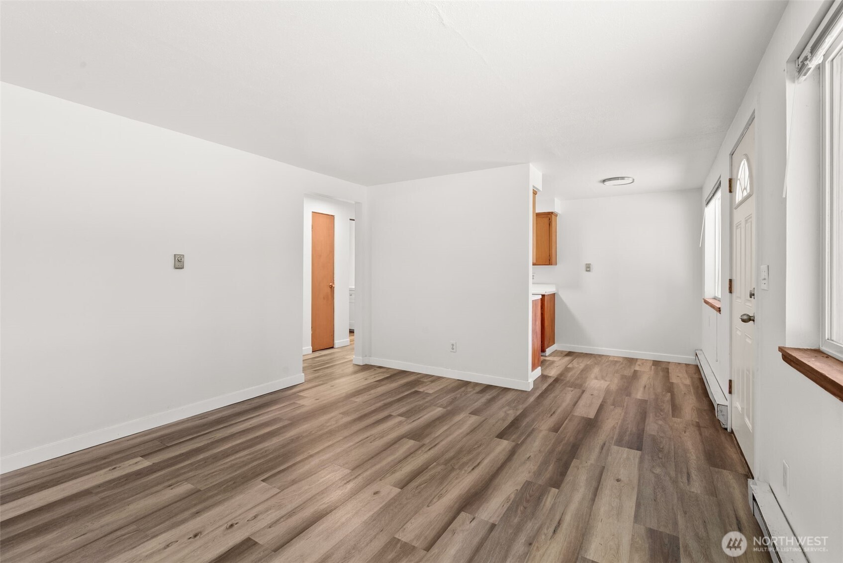 1000 Creso Road South Spanaway, WA 98387 - Photo 36 of 40 a view of a room with wooden floor and white walls