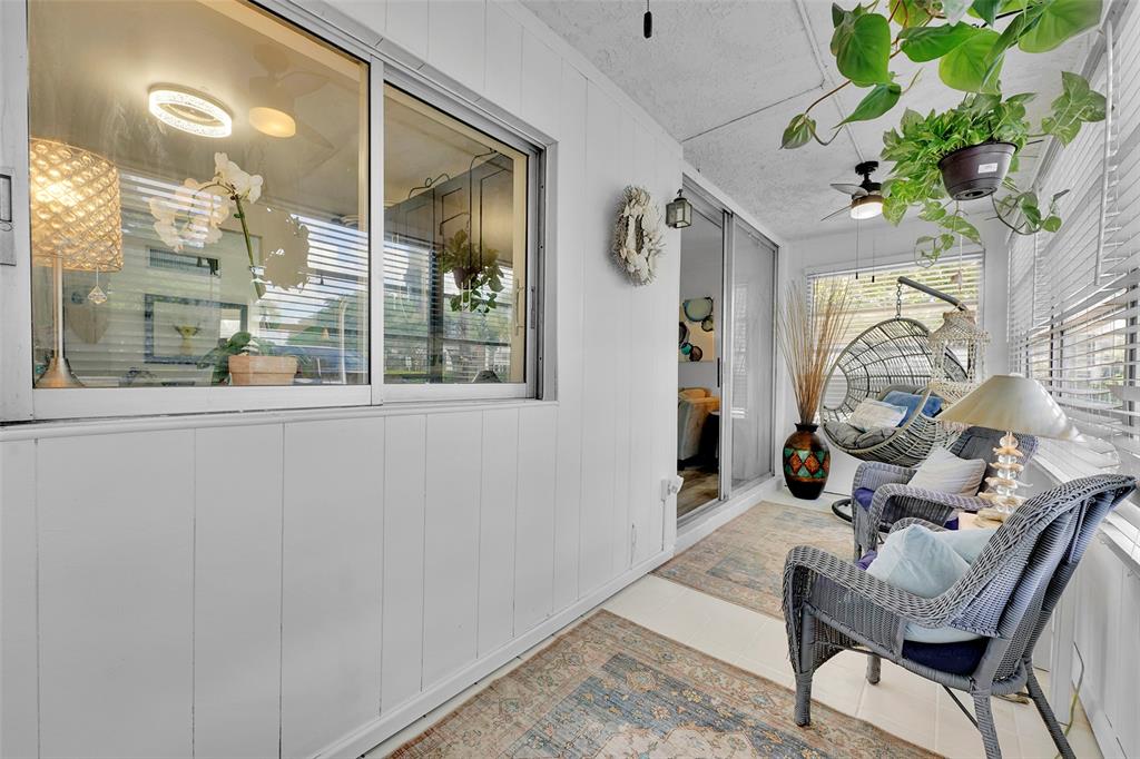 9090 Lime Bay Boulevard, Unit 112 Tamarac, FL 33321 - Photo 14 of 55 a living room with furniture