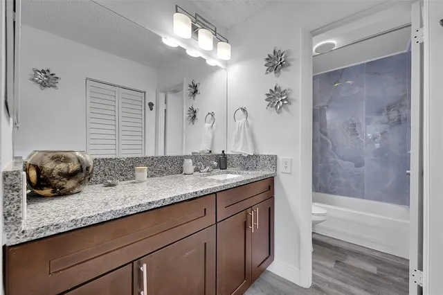 a bathroom with a shower and a toilet