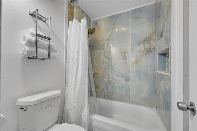 a bedroom with a bed and a walk in closet