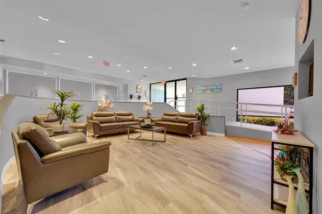 a room with lots of furniture and a chandelier