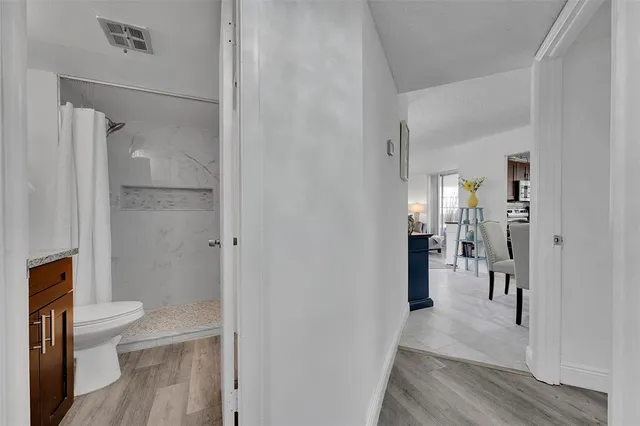 a bathroom with a shower and a toilet