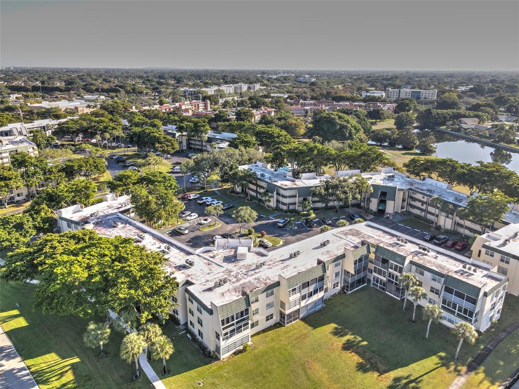 9090 Lime Bay Boulevard, Unit 112 Tamarac, FL 33321 - Photo 42 of 55 an aerial view of residential houses with outdoor space