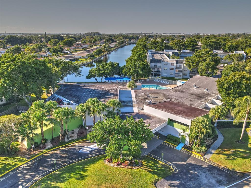 9090 Lime Bay Boulevard, Unit 112 Tamarac, FL 33321 - Photo 49 of 55 an aerial view of a house with a garden