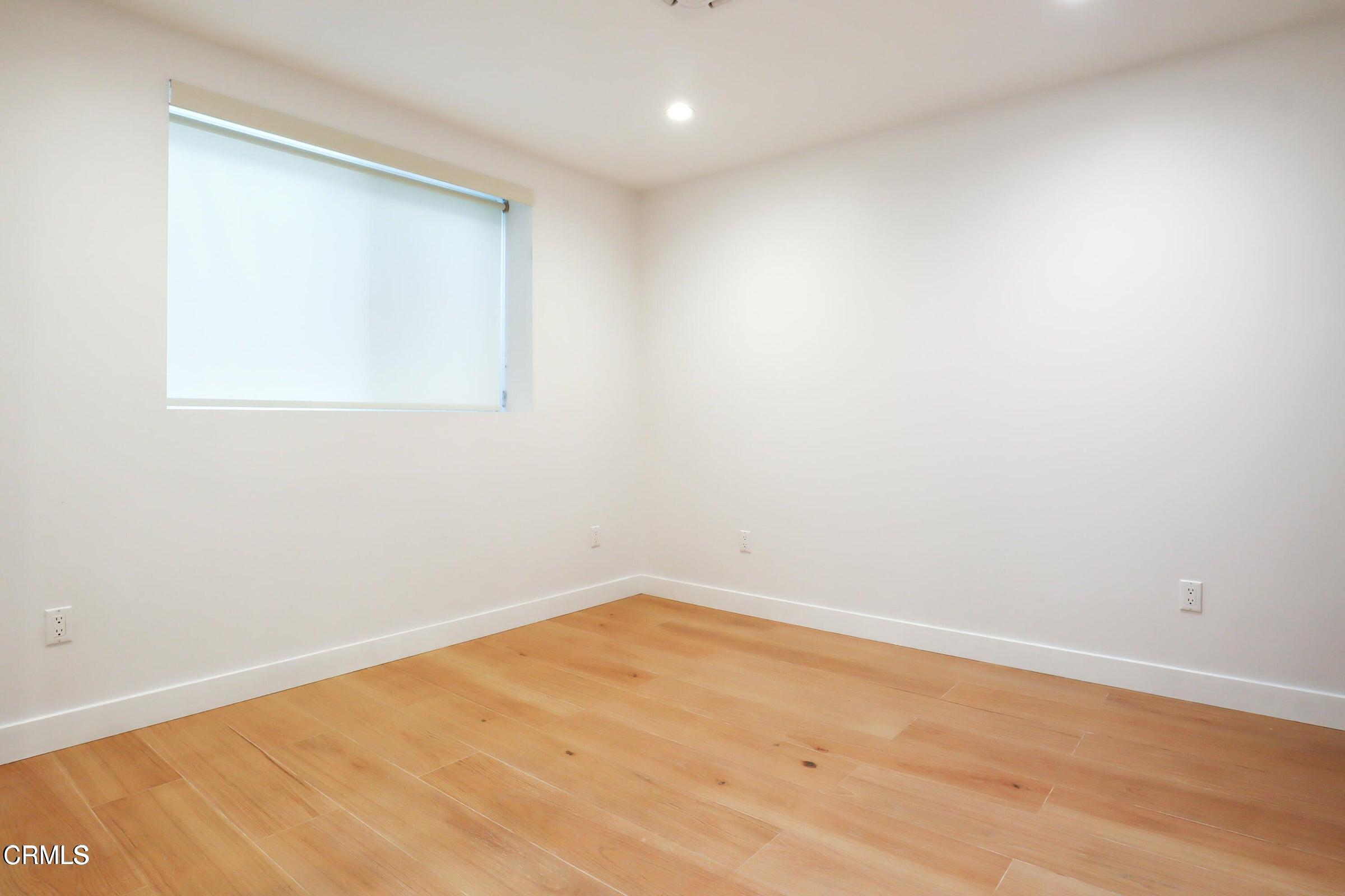 112 North Kenneth Road, Unit 101 Burbank, CA 91501 - Photo 16 of 20 an empty room with a window