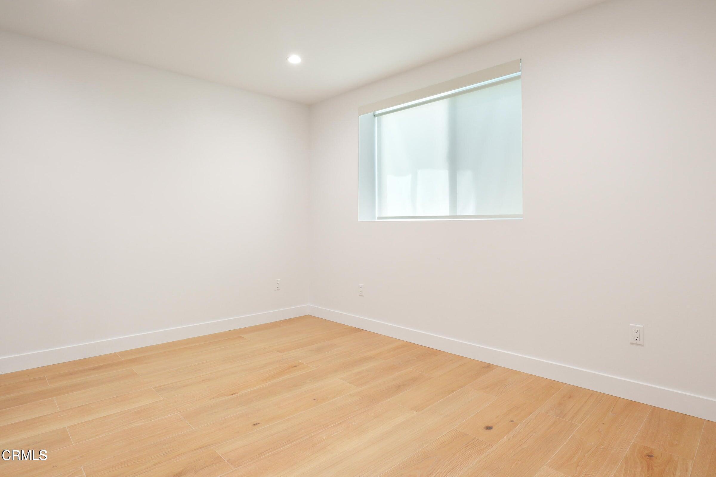 112 North Kenneth Road, Unit 101 Burbank, CA 91501 - Photo 17 of 20 an empty room with a window