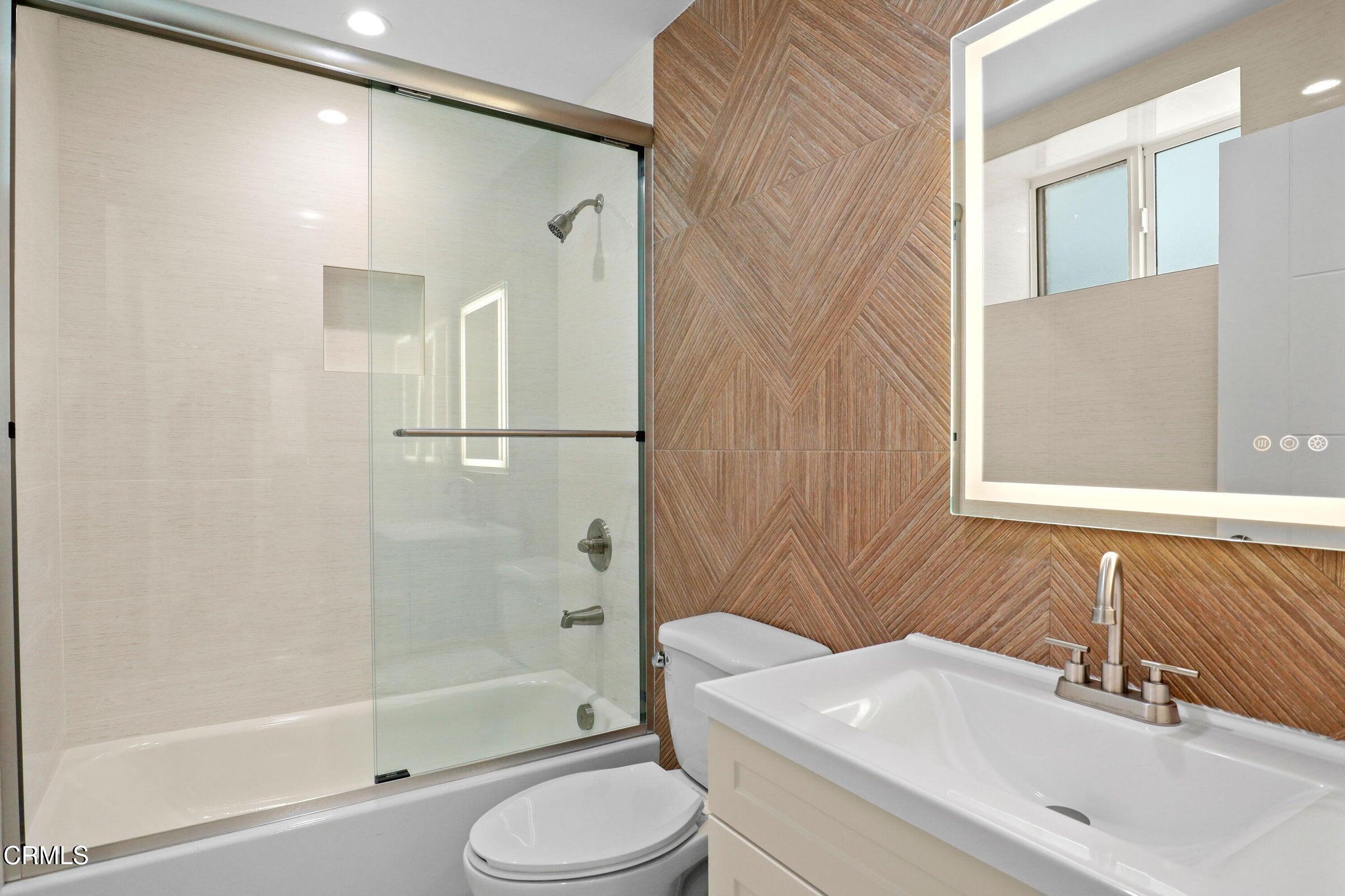 112 North Kenneth Road, Unit 101 Burbank, CA 91501 - Photo 18 of 20 a bathroom with a sink a toilet and shower