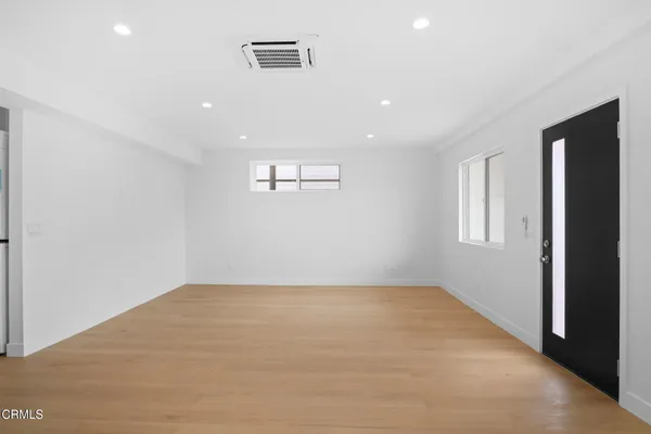 a view of a kitchen with microwave and cabinets