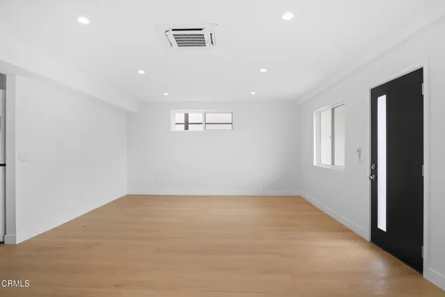 a view of a kitchen with microwave and cabinets