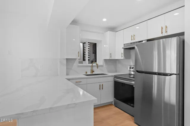 a view of a hallway with washer and dryer