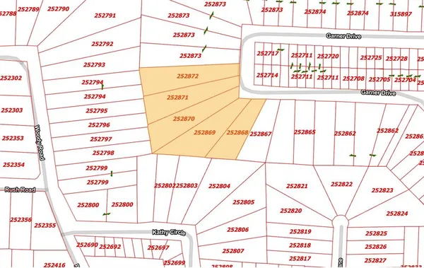 a kitchen with a refrigerator and white cabinets