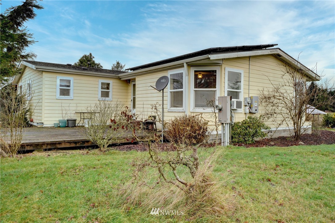 4908 183rd Avenue Southwest Rochester, WA 98579 - Photo 22 of 38 a front view of house with yard and green space
