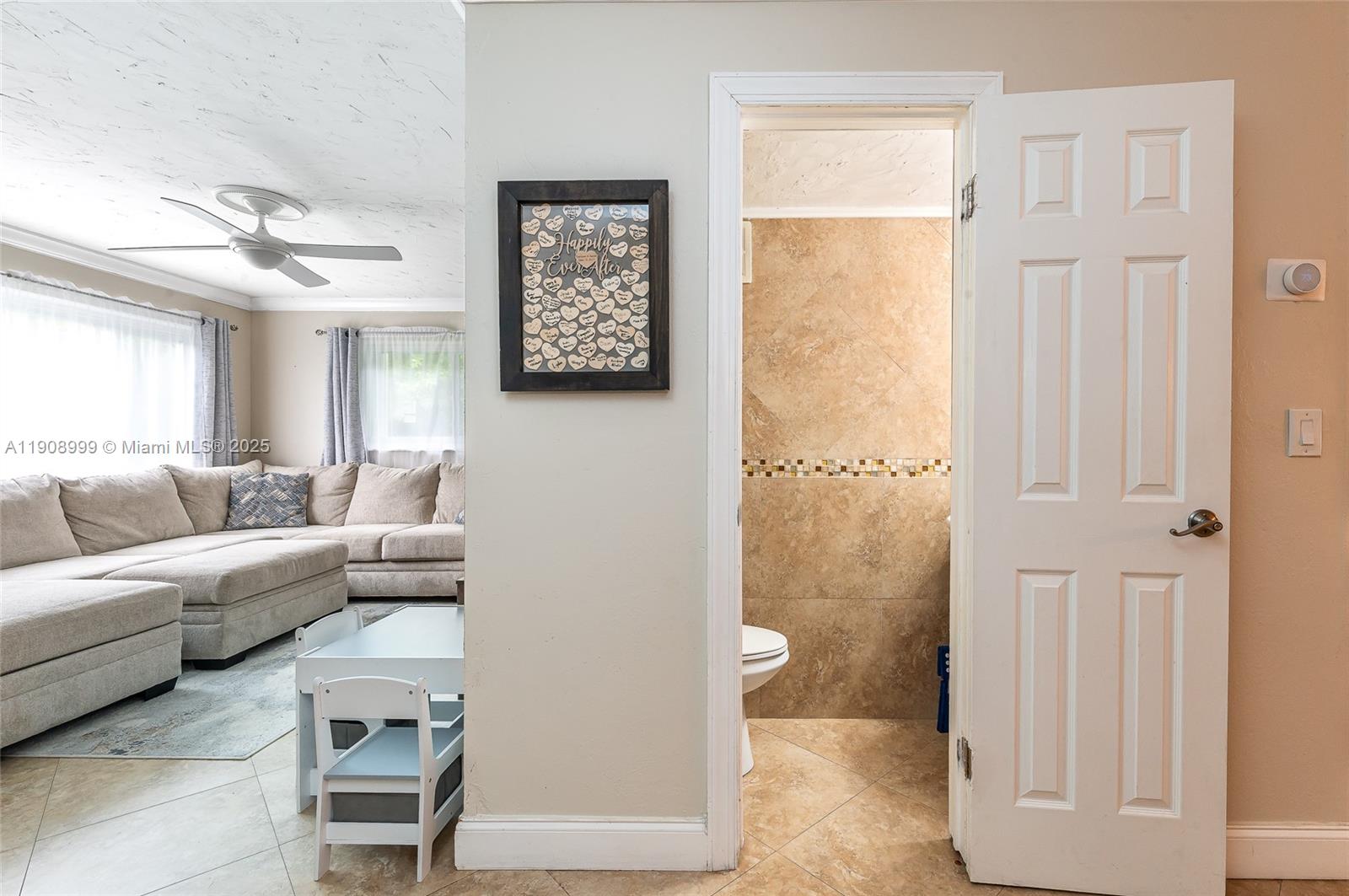 6797 Southwest 40th Street, Unit 71 Davie, FL 33314 - Photo 11 of 35 a living room with furniture and a gate