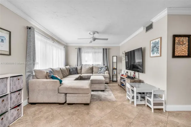 a living room with furniture and a window