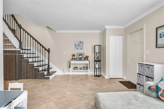 a view of a livingroom with furniture and a livingroom with furniture