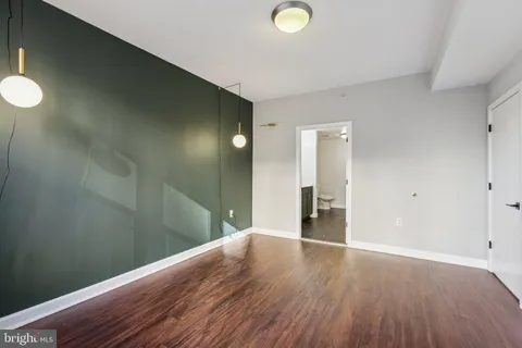 a view of a livingroom with wooden floor