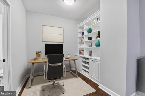 a room with furniture and white walls