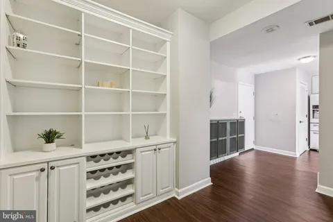 a view of wooden floor and windows in a room