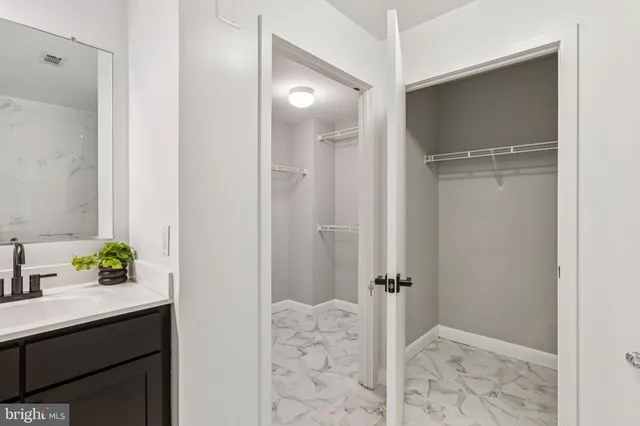 a bathroom with a shower and a sink