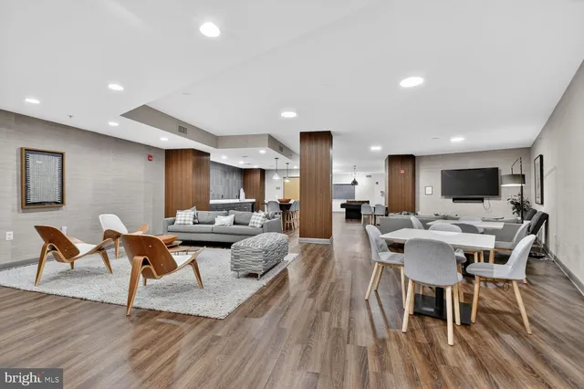 a view of a dining room with furniture wooden floor and a rug
