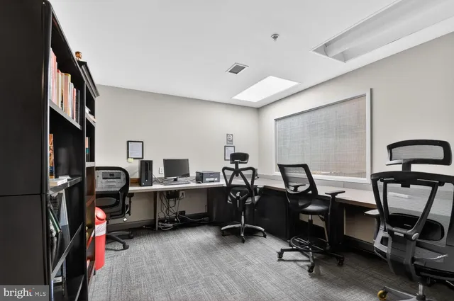 a view of a workspace with gym equipment