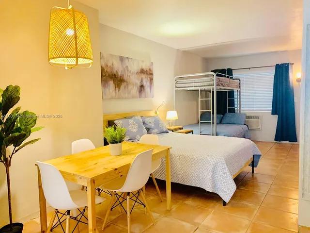 a bedroom with a bed and a table