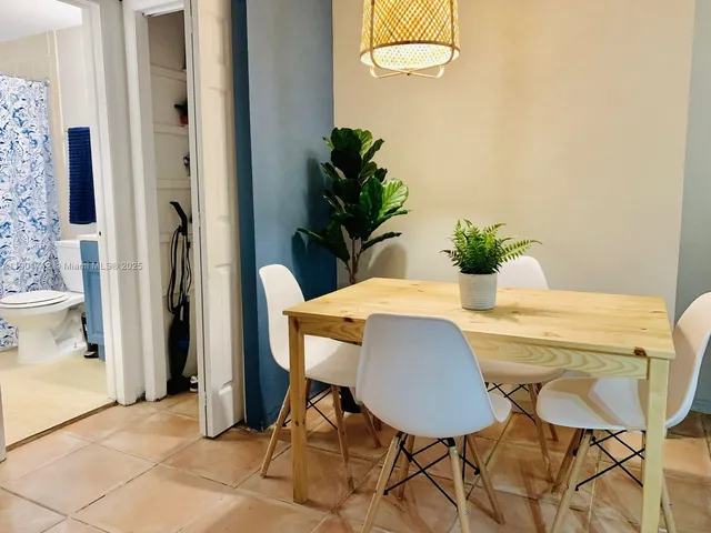 a bathroom with a tub and shower
