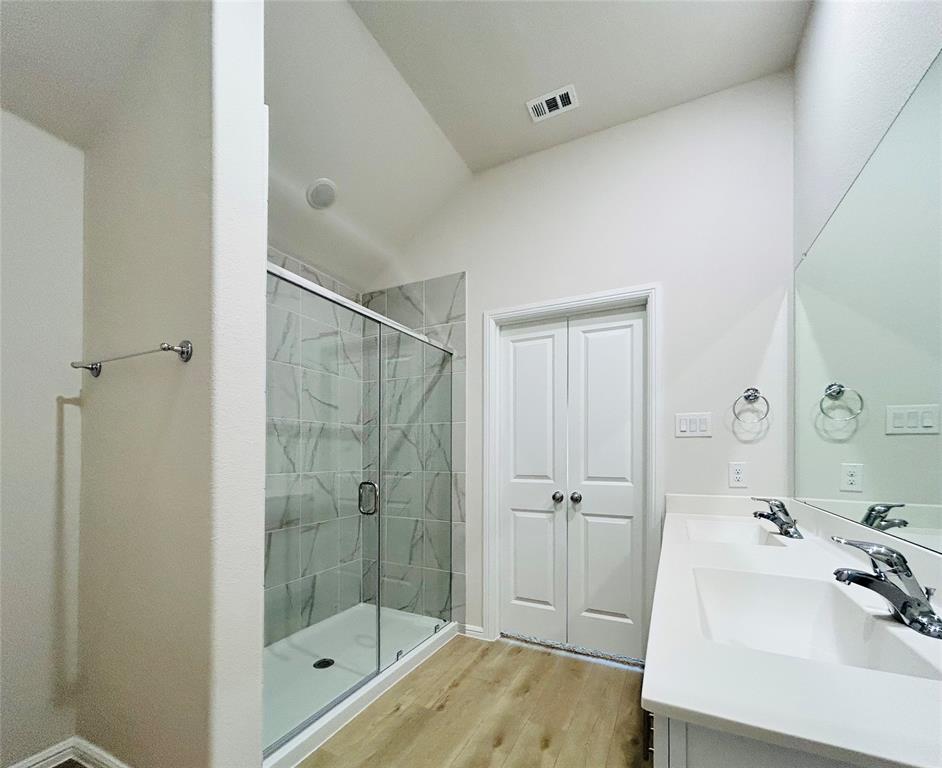 2505 McNally Drive Mesquite, TX 75181 - Photo 17 of 28 a bathroom with a sink a toilet and shower