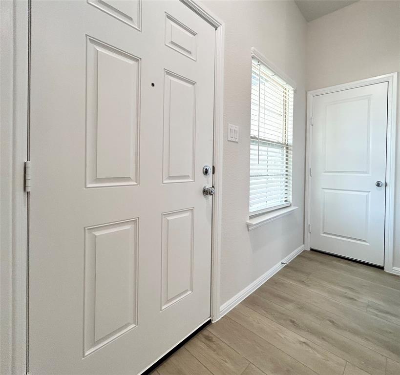 2505 McNally Drive Mesquite, TX 75181 - Photo 9 of 28 an empty room with wooden floor closet and windows