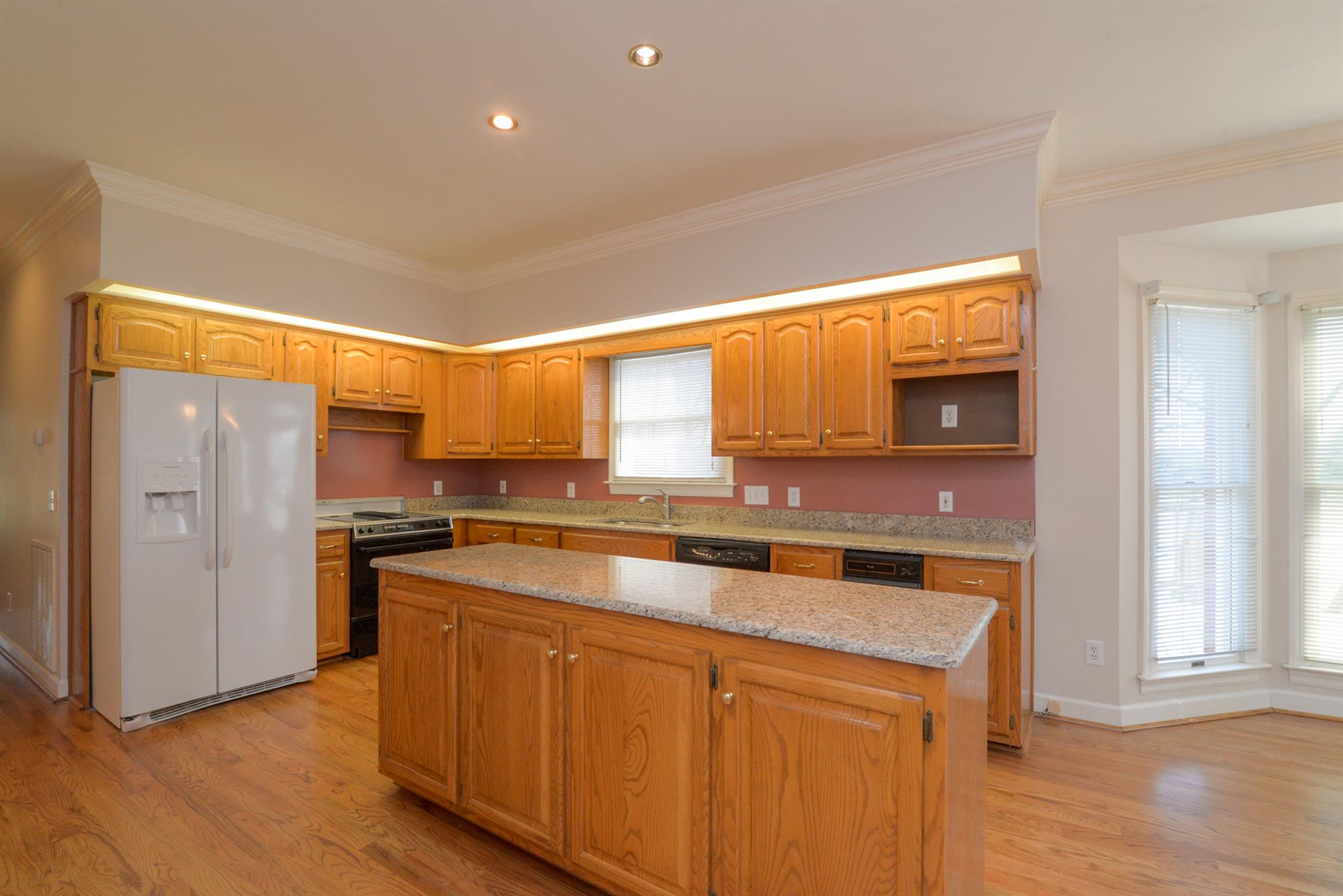 320 Goshen Road Lebanon, TN 37087 - Photo 14 of 28 a kitchen with stainless steel appliances a sink cabinets and wooden floor