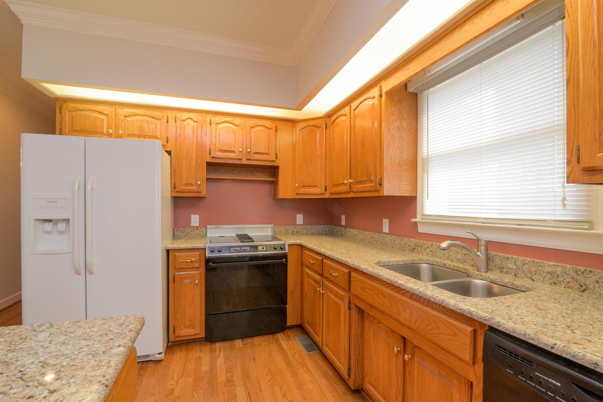 320 Goshen Road Lebanon, TN 37087 - Photo 15 of 28 a kitchen with stainless steel appliances granite countertop a sink a stove and refrigerator