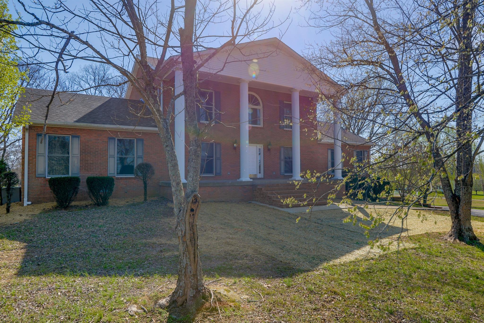 320 Goshen Road Lebanon, TN 37087 - Photo 2 of 28 a view of a brick building next to a yard